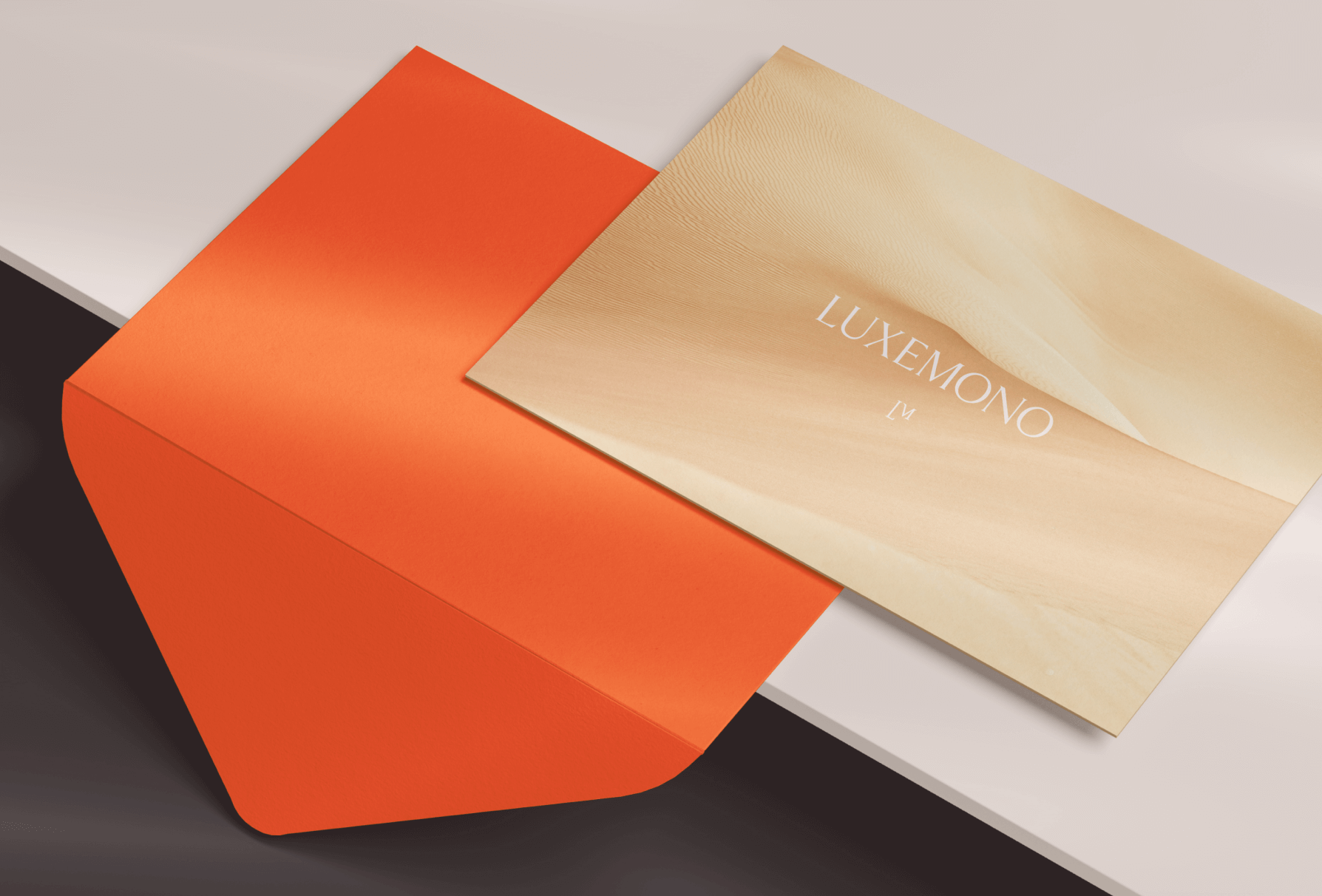 Luxemono's brand identity applied on print invitation